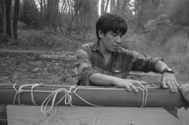 [Norman preparing model canoe for third steaming]