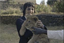 Lorna R. Marsden with lion cub (?)