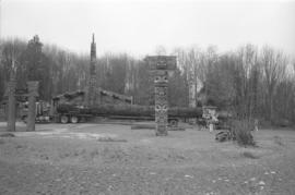 [Totem poles, long house and truck on MOA grounds]