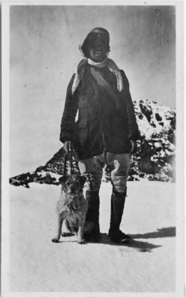 Man in snow with dog