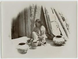 Zuni Dick's wife making pottery