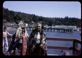Two men in regalia on dock, Alert Bay