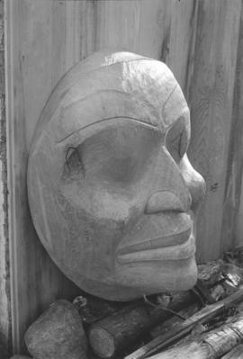 [Close-up of side profile of face carving]
