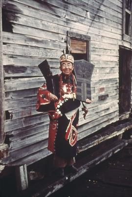 Man in regalia with coppers