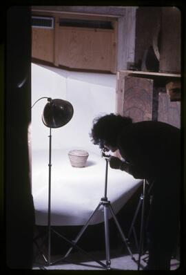 Laura Greenberg photographing baskets