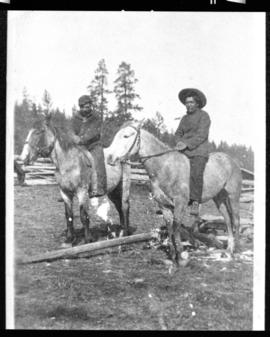 Portrait of two men on horseback