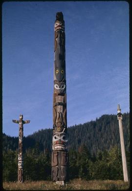 L-R, Raven pole #24, Dogfish pole #23, secretary of state pole #27, Saxman Park, Ketchikan, Alaska
