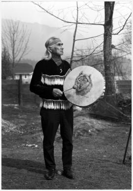 Hon. Chief Dan George, Burrard Reserve [Tsleil-Waututh], North Vancouver with drum painted by Min...