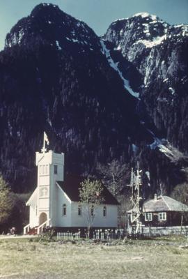 Christian church at base of steep mountain