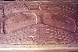 Wood relief carving with eyes
