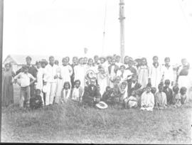 Group portrait in front of a pole