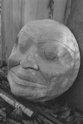 [Close-up of large carving of face]