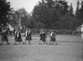 Girls walking in pairs on field