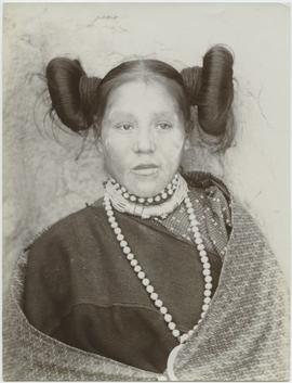 Hopi woman with squash blossom whorl
