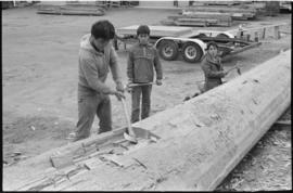 Crew working on log at the Turnbull & Gail construction yard in Richmond (contractors for bui...