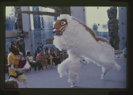 Dancer with sword and lion dancers