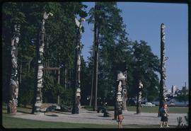 Totem poles and Vancouver sky line, Stanley Park, Vancouver, B.C.