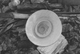 [Close-up of hat on firewood]