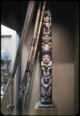 Model totem pole and harpoons on display in Montréal