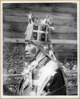 Profile view of man in ceremonial dress