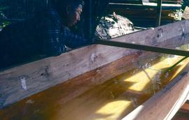 Carving a canoe