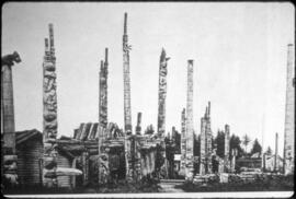 Totem poles and houses at an Indigenous town