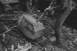 [Chip shapes large beaver bowl carving with chainsaw]