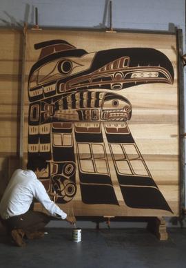 Roy Hanuse painting a panel