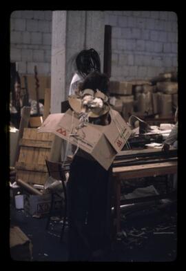 Gillian Darling wearing a cardboard mask