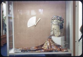 A lady's jacket, bridal headdress, and fan