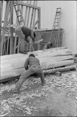 Crew working on log at the Turnbull & Gail construction yard in Richmond (contractors for bui...