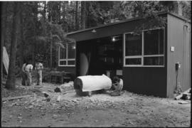 Crew and log at the old UBC carving shed