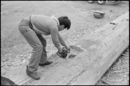 Crew working on log at the Turnbull & Gail construction yard in Richmond (contractors for bui...