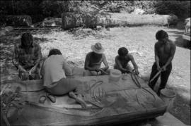 Crew making regalia for pole raising