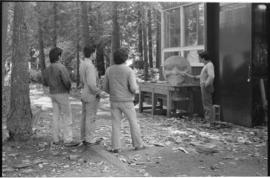 Crew and log at the old UBC carving shed