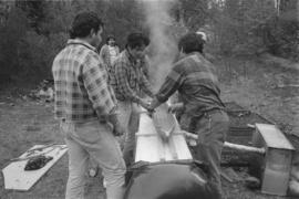 [Readying model canoe for first steam]