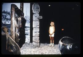 Girl viewing a display in the Potlatch Pavilion Theatre