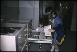 Shirley Cuthbertson with children in visible storage