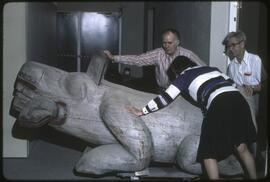 Inge Ruus and Anthony Carter posing with wasgo sculpture in the new Museum of Anthropology