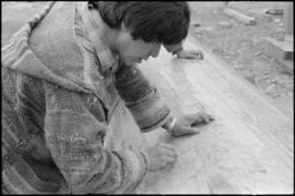 Crew working on log at the Turnbull & Gail construction yard in Richmond (contractors for bui...