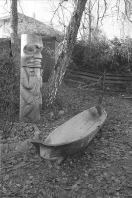 [Totem pole and canoe]