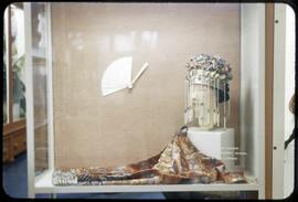 A lady's jacket, bridal headdress, and fan