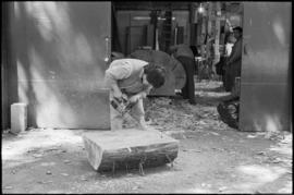 Crew and log at the old UBC carving shed