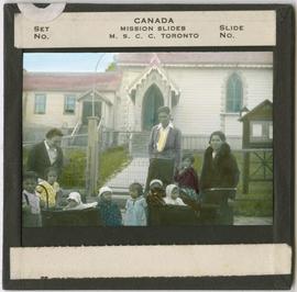 People in Front of a Church in Alert Bay