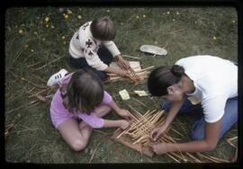 Children weaving cedar