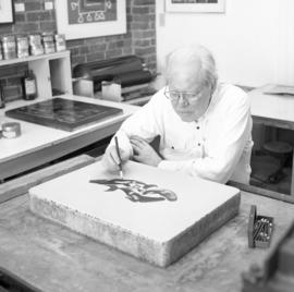 [Bill Reid drawing on lithographic stone]