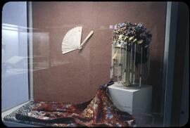 A lady's jacket, bridal headdress, and fan