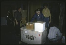 Men moving items  as part of the move to the new Museum of Anthropology
