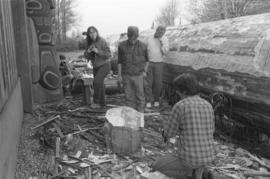 [Chip shapes large beaver bowl carving with chainsaw]