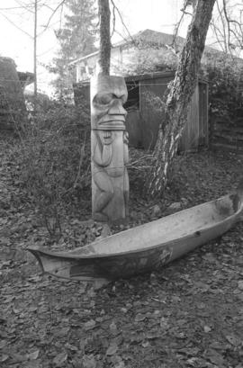 [Totem pole and canoe]